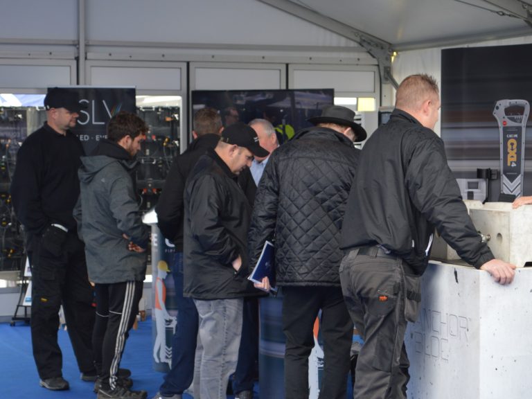 Visitors to C.Scope Stand in the Marquee Suppliers' Pavilion